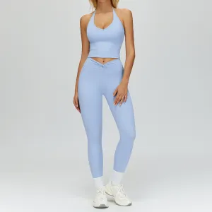 Conjunto de dos piezas para mujer: camisola de color liso, pantalones ajustados con pliegues retorcidos, ideal para yoga y deportes.