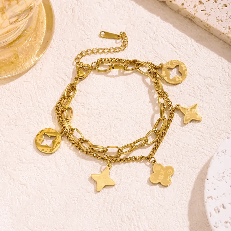 Women Fashion Gold Hollow-Out Four-Leaf Clover Tassel Bracelet Clover Jewelry