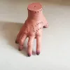 Dark-Colored Severed Hand