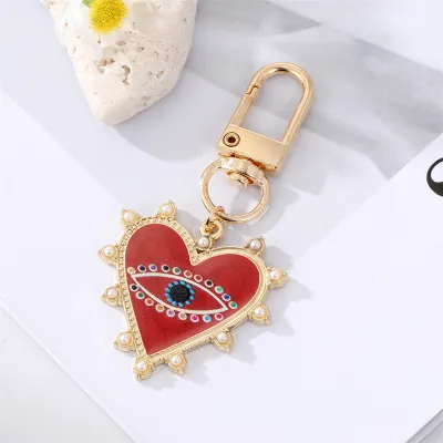Unisex Classic Imitation Pearl Rhinestone Decoration Heart Shaped Evil Eye Keychain