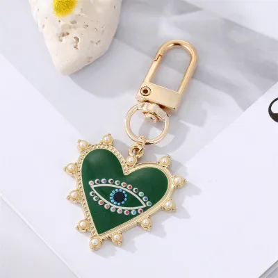 Unisex Classic Imitation Pearl Rhinestone Decoration Heart Shaped Evil Eye Keychain