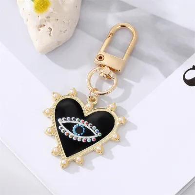 Unisex Classic Imitation Pearl Rhinestone Decoration Heart Shaped Evil Eye Keychain