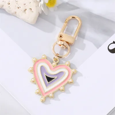 Unisex Classic Imitation Pearl Rhinestone Decoration Heart Shaped Evil Eye Keychain
