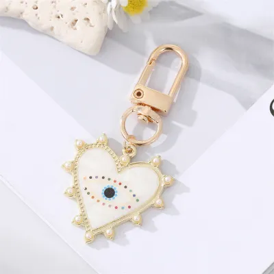 Unisex Classic Imitation Pearl Rhinestone Decoration Heart Shaped Evil Eye Keychain