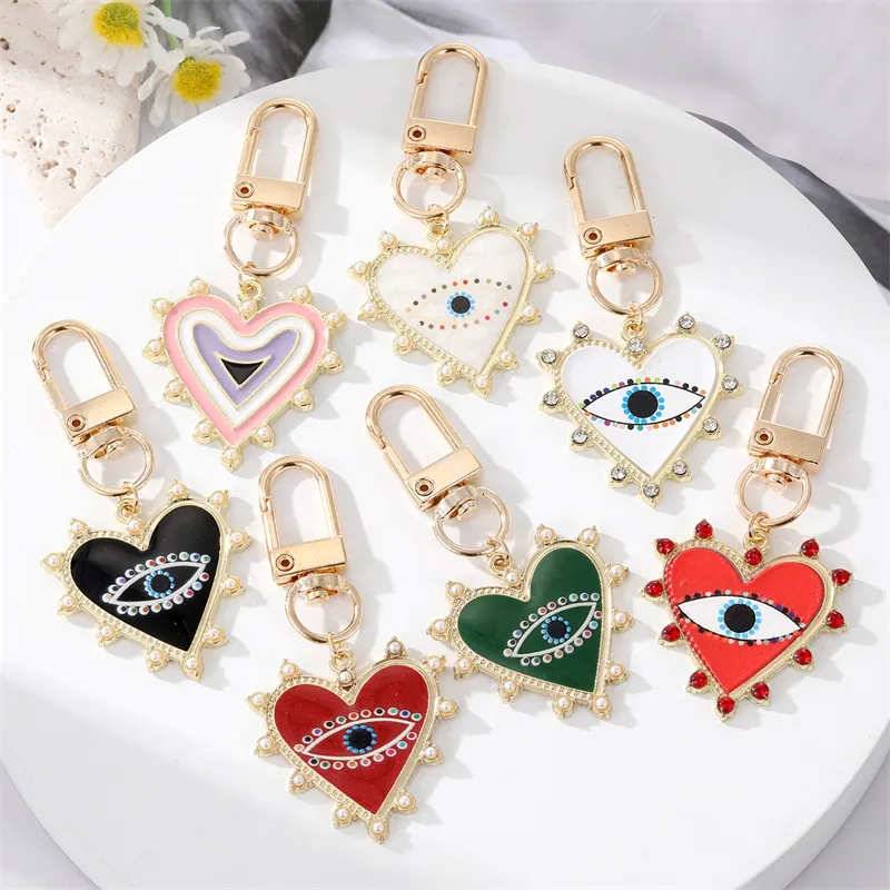 Unisex Classic Imitation Pearl Rhinestone Decoration Heart Shaped Evil Eye Keychain
