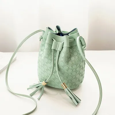 Women PU Bucket Crossbody Bag with Tassel Drawstring Decorative Design