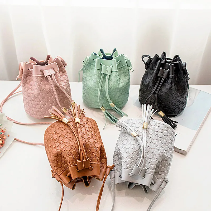 Women PU Bucket Crossbody Bag with Tassel Drawstring Decorative Design