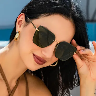 Women Fashion Frameless UV400 Cat Eye Sunglasses Metal PC Lens