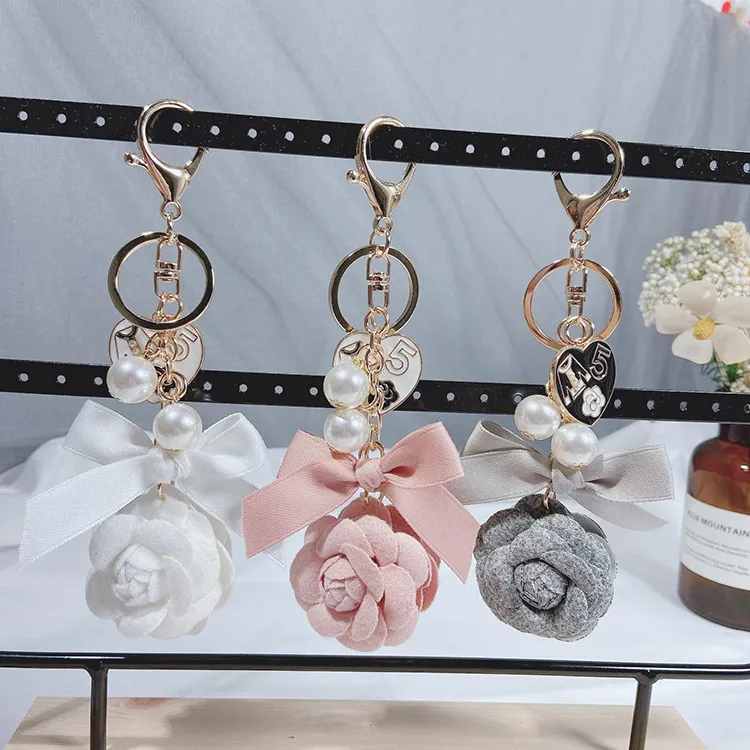 Women Fashion Creative Double-Sided Camellia Pearl Chain Key Chain Pendant