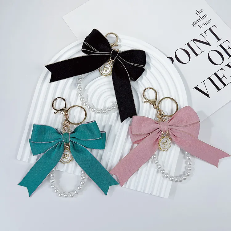 Women Fashion Exaggerated Bow Pearl Chain Keychain Pendant