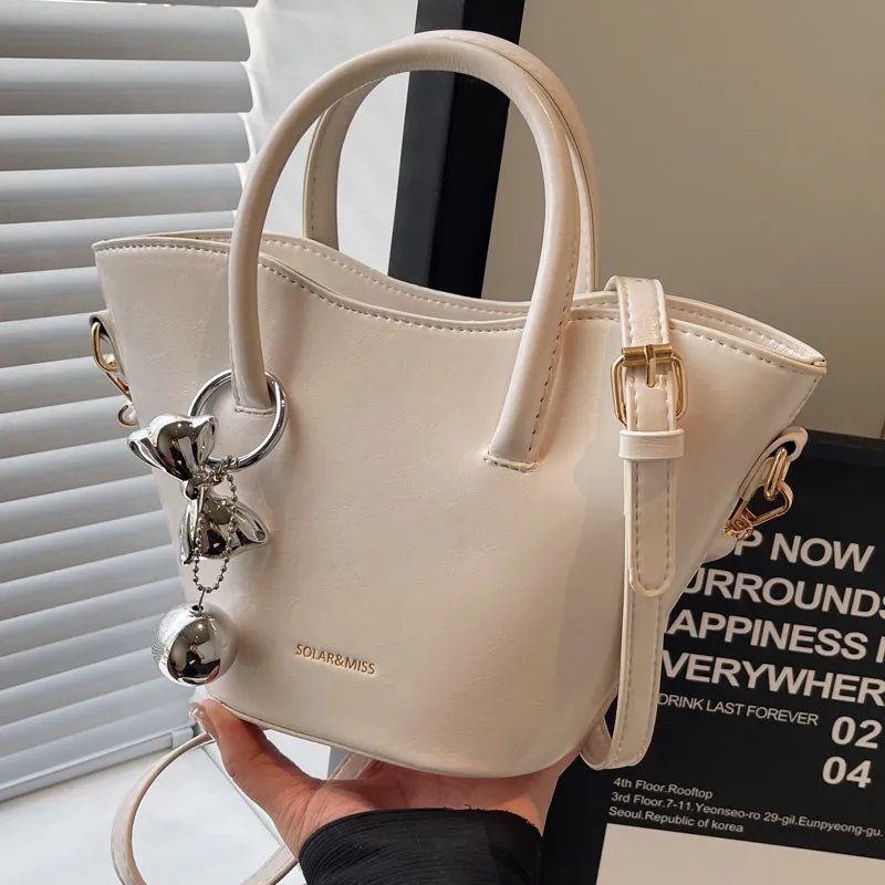 Women Fashionable Bow Ball Pendant PU Handle Shoulder Bucket Bag