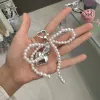 Pearl Bow Love Pendant